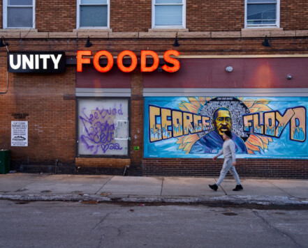 A man walks in front of the George Floyd mural on the side of "Unity Foods". Unity Foods was formerly named Cup Foods. A man walks in front of the George Floyd mural on the side of "Unity Foods". Unity Foods was formerly named Cup Foods.