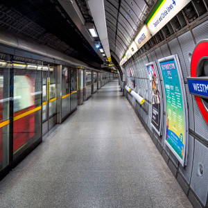 Westminster is a London Underground station in the City of Westminster. It is served by the Circle, District and Jubilee lines. On the Circle and District lines, the station is between St. James's Park and Embankment, and on the Jubilee line it is between Green Park and Waterloo. It is in Travelcard Zone 1. The station is located at the corner of Bridge Street and Victoria Embankment and is close to the Houses of Parliament, Westminster Abbey, Parliament Square, Whitehall, Westminster Bridge, and the London Eye. Also close by are Downing Street, the Cenotaph, Westminster Millennium Pier, the Treasury, the Foreign and Commonwealth Office, and the Supreme Court.The station is in two parts: sub-surface platforms opened in 1868 by the District Railway (DR) as part of the company's first section of the Inner Circle route and deep level platforms opened in 1999 as part of the Jubilee line extension from Green Park to Stratford. A variety of underground and main line services have operated over the sub-surface tracks, but the original station was completely rebuilt in conjunction with the construction of the deep level platforms and Portcullis House, which sits above the station. Source: <a href="https://en.wikipedia.org/wiki/Westminster_tube_station" rel="noreferrer nofollow">en.wikipedia.org/wiki/Westminster_tube_station</a> Westminster is a London Underground station in the City of Westminster. It is served by the Circle, District and Jubilee lines. On the Circle and District lines, the station is between St. James's Park and Embankment, and on the Jubilee line it is between Green Park and Waterloo. It is in Travelcard Zone 1. The station is located at the corner of Bridge Street and Victoria Embankment and is close to the Houses of Parliament, Westminster Abbey, Parliament Square, Whitehall, Westminster Bridge, and the London Eye. Also close by are Downing Street, the Cenotaph, Westminster Millennium Pier, the Treasury, the Foreign and Commonwealth Office, and the Supreme Court.The station is in two parts: sub-surface platforms opened in 1868 by the District Railway (DR) as part of the company's first section of the Inner Circle route and deep level platforms opened in 1999 as part of the Jubilee line extension from Green Park to Stratford. A variety of underground and main line services have operated over the sub-surface tracks, but the original station was completely rebuilt in conjunction with the construction of the deep level platforms and Portcullis House, which sits above the station. Source: <a href="https://en.wikipedia.org/wiki/Westminster_tube_station" rel="noreferrer nofollow">en.wikipedia.org/wiki/Westminster_tube_station</a>