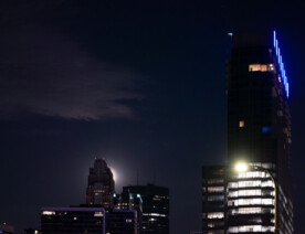 Full Moon in Downtown Minneapolis behind Wells Fargo Center and the Four Seasons Hotel.