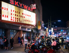 Motorcycles and hot rodders outside the Skyway Theatre in Downtown Minneapolis.
