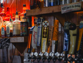 Cuzzy’s Grill & Bar on Washington Avenue in the North Loop, the building has been home to a bar for most of the years since 1894. A "Welcome to Minneapolis" patch behind the bar.