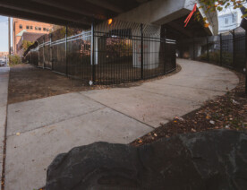 New fencing dropped in the North Loop on N 5th Ave and I-94. It's too bad, was a fun spot to watch trains.  Could see the Light Rail, Northstar Line and freight trains from under this bridge.