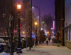 A jogger in the snow on Washington Avenue in the North Loop near Bunkers Bar & Grill.