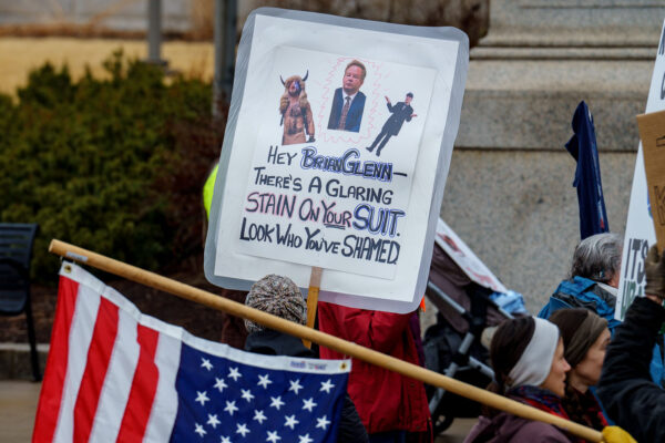 "Hey Brian Glenn There's a Glaring Stain On Your Suit. Look Who You've Shamed" protest sign.Protesters at the Minnesota State Capitol in St. Paul, Minnesota on March 4, 2025.  Taking place on the afternoon of President Trump’s first address to joint session in congress, they are protesting the actions of the Trump Administration and Elon Musk’s involvement. The protest was organized as part of the “50501” protests taking place around the country. This is the first of two planned protests this week. Another is planned for Saturday at the State Capitol. "Hey Brian Glenn There's a Glaring Stain On Your Suit. Look Who You've Shamed" protest sign.Protesters at the Minnesota State Capitol in St. Paul, Minnesota on March 4, 2025.  Taking place on the afternoon of President Trump’s first address to joint session in congress, they are protesting the actions of the Trump Administration and Elon Musk’s involvement. The protest was organized as part of the “50501” protests taking place around the country. This is the first of two planned protests this week. Another is planned for Saturday at the State Capitol.