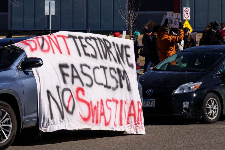 Large protest banner outside a Tesla facility in Minneapolis (Golden Valley) that reads:"Don't testdrive fascism No Swasticar!" Large protest banner outside a Tesla facility in Minneapolis (Golden Valley) that reads:"Don't testdrive fascism No Swasticar!"