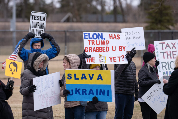 About 500 protesters outside Tesla in Minneapolis (Golden Valley) with signs reading “NOT PAID JUST PISSED”, “Tesla Funds Fascists”, “Save the VA”, “No Vet Left Behind”, Make Nazis Afraid Again” to name a few. This is the 7th weekend in a row of protests at this showroom. About 500 protesters outside Tesla in Minneapolis (Golden Valley) with signs reading “NOT PAID JUST PISSED”, “Tesla Funds Fascists”, “Save the VA”, “No Vet Left Behind”, Make Nazis Afraid Again” to name a few. This is the 7th weekend in a row of protests at this showroom.