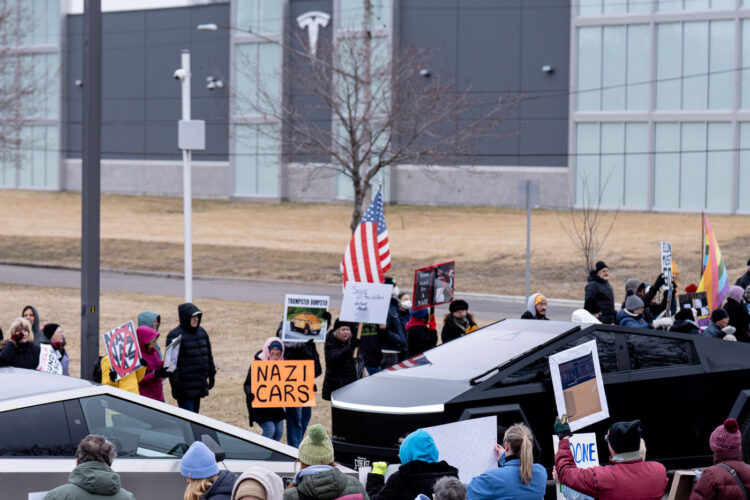 About 500 protesters outside Tesla in Minneapolis (Golden Valley) with signs reading “NOT PAID JUST PISSED”, “Tesla Funds Fascists”, “Save the VA”, “No Vet Left Behind”, Make Nazis Afraid Again” to name a few. This is the 7th weekend in a row of protests at this showroom. About 500 protesters outside Tesla in Minneapolis (Golden Valley) with signs reading “NOT PAID JUST PISSED”, “Tesla Funds Fascists”, “Save the VA”, “No Vet Left Behind”, Make Nazis Afraid Again” to name a few. This is the 7th weekend in a row of protests at this showroom.