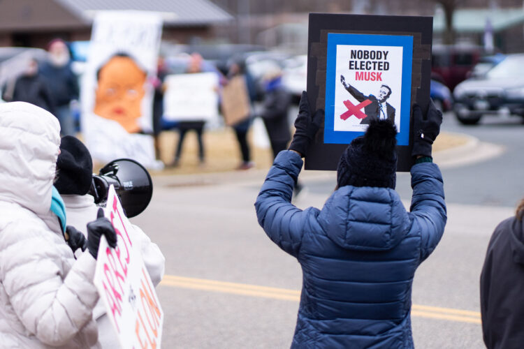 About 500 protesters outside Tesla in Minneapolis (Golden Valley) with signs reading “NOT PAID JUST PISSED”, “Tesla Funds Fascists”, “Save the VA”, “No Vet Left Behind”, Make Nazis Afraid Again” to name a few. This is the 7th weekend in a row of protests at this showroom. About 500 protesters outside Tesla in Minneapolis (Golden Valley) with signs reading “NOT PAID JUST PISSED”, “Tesla Funds Fascists”, “Save the VA”, “No Vet Left Behind”, Make Nazis Afraid Again” to name a few. This is the 7th weekend in a row of protests at this showroom.