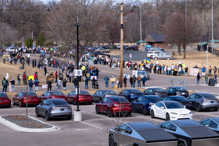 Tesla Takedown protest at a Tesla showroom in Minneapolis (Golden Valley) on March 22, 2025. This is the 6th week in a row protesters have gathered. The crowd has continued to grow exponentially each week. Tesla Takedown protest at a Tesla showroom in Minneapolis (Golden Valley) on March 22, 2025. This is the 6th week in a row protesters have gathered. The crowd has continued to grow exponentially each week.