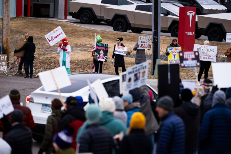 About 500 protesters outside Tesla in Minneapolis (Golden Valley) with signs reading “NOT PAID JUST PISSED”, “Tesla Funds Fascists”, “Save the VA”, “No Vet Left Behind”, Make Nazis Afraid Again” to name a few. This is the 7th weekend in a row of protests at this showroom. About 500 protesters outside Tesla in Minneapolis (Golden Valley) with signs reading “NOT PAID JUST PISSED”, “Tesla Funds Fascists”, “Save the VA”, “No Vet Left Behind”, Make Nazis Afraid Again” to name a few. This is the 7th weekend in a row of protests at this showroom.