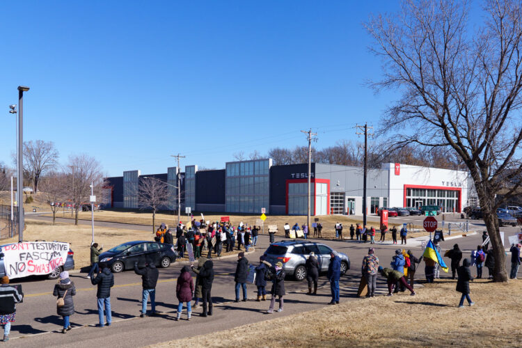 Protesters outside of a Tesla facility in Golden Valley, Minnesota on March 1st, 2025. This is the third weekend in a row they've gathered to protest the actions of Elon Musk and the current administration. Protesters outside of a Tesla facility in Golden Valley, Minnesota on March 1st, 2025. This is the third weekend in a row they've gathered to protest the actions of Elon Musk and the current administration.