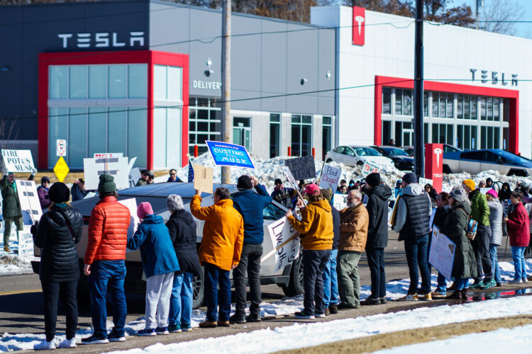 Tesla Cybertruck drives to a Tesla Facility just outside of Minneapolis (Golden Valley) on March 8, 2025.This is the 4th week in a row protesters have gathered here as part of the nationwide Tesla Takedown organizing. Tesla Cybertruck drives to a Tesla Facility just outside of Minneapolis (Golden Valley) on March 8, 2025.This is the 4th week in a row protesters have gathered here as part of the nationwide Tesla Takedown organizing.