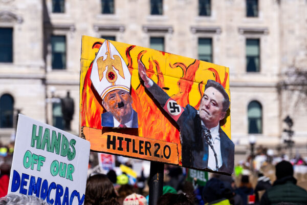 "Hitler 2.0" protest sign.The Minnesota State Patrol estimates 25,000 gathered at the Minnesota State Capitol this afternoon as part of the nationwide “Hands Off!” protests. "Hitler 2.0" protest sign.The Minnesota State Patrol estimates 25,000 gathered at the Minnesota State Capitol this afternoon as part of the nationwide “Hands Off!” protests.