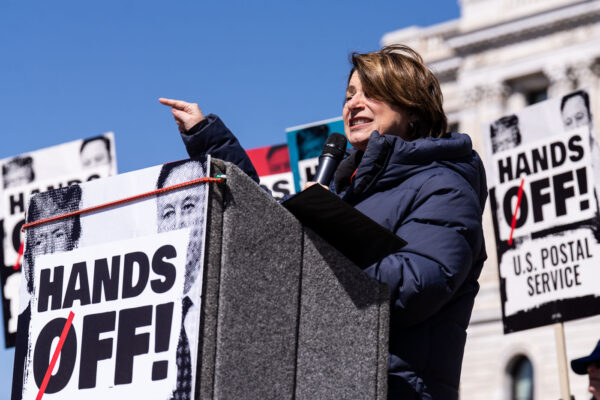 Amy Klobuchar speaking to a crowd of around 25,000 at a "Hands Off!" protest at the Minnesota State Capitol Amy Klobuchar speaking to a crowd of around 25,000 at a "Hands Off!" protest at the Minnesota State Capitol