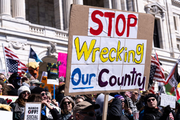 Protester holds up a sign that reads "Stop Wrecking Our Country"The Minnesota State Patrol estimates 25,000 gathered at the Minnesota State Capitol this afternoon as part of the nationwide “Hands Off!” protests. Protester holds up a sign that reads "Stop Wrecking Our Country"The Minnesota State Patrol estimates 25,000 gathered at the Minnesota State Capitol this afternoon as part of the nationwide “Hands Off!” protests.
