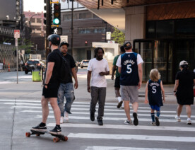 Fans in downtown Minneapolis heading to Target Center for a Minnesota Timberwolves playoff game.