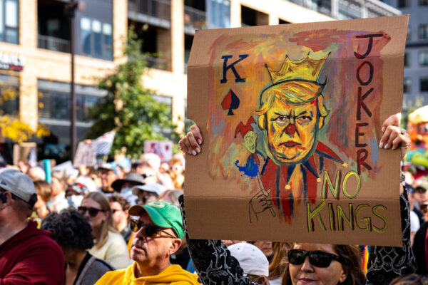 Woman holds up a sign at No Kings Minneapolis.Thousands protest in Downtown Minneapolis on Saturday October 18, 2025 as part of nationwide “No Kings!” protest. Organizers say 100,000 attended. Woman holds up a sign at No Kings Minneapolis.Thousands protest in Downtown Minneapolis on Saturday October 18, 2025 as part of nationwide “No Kings!” protest. Organizers say 100,000 attended.
